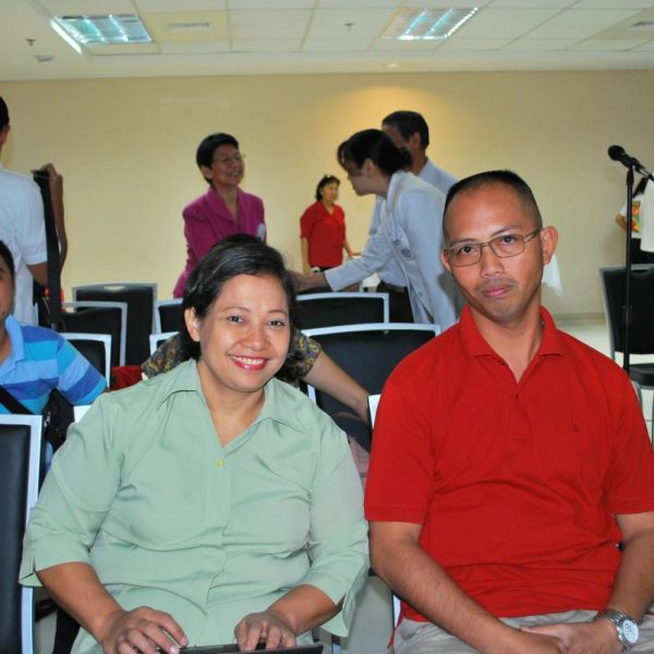 Mr. Rene Macalalad, L (Leukemia Patient) with Ms. Helen Alega, R (Mother of Leukemia Patient Jezreel Alega).  At background are Dr. Demerre and EMC Pastors